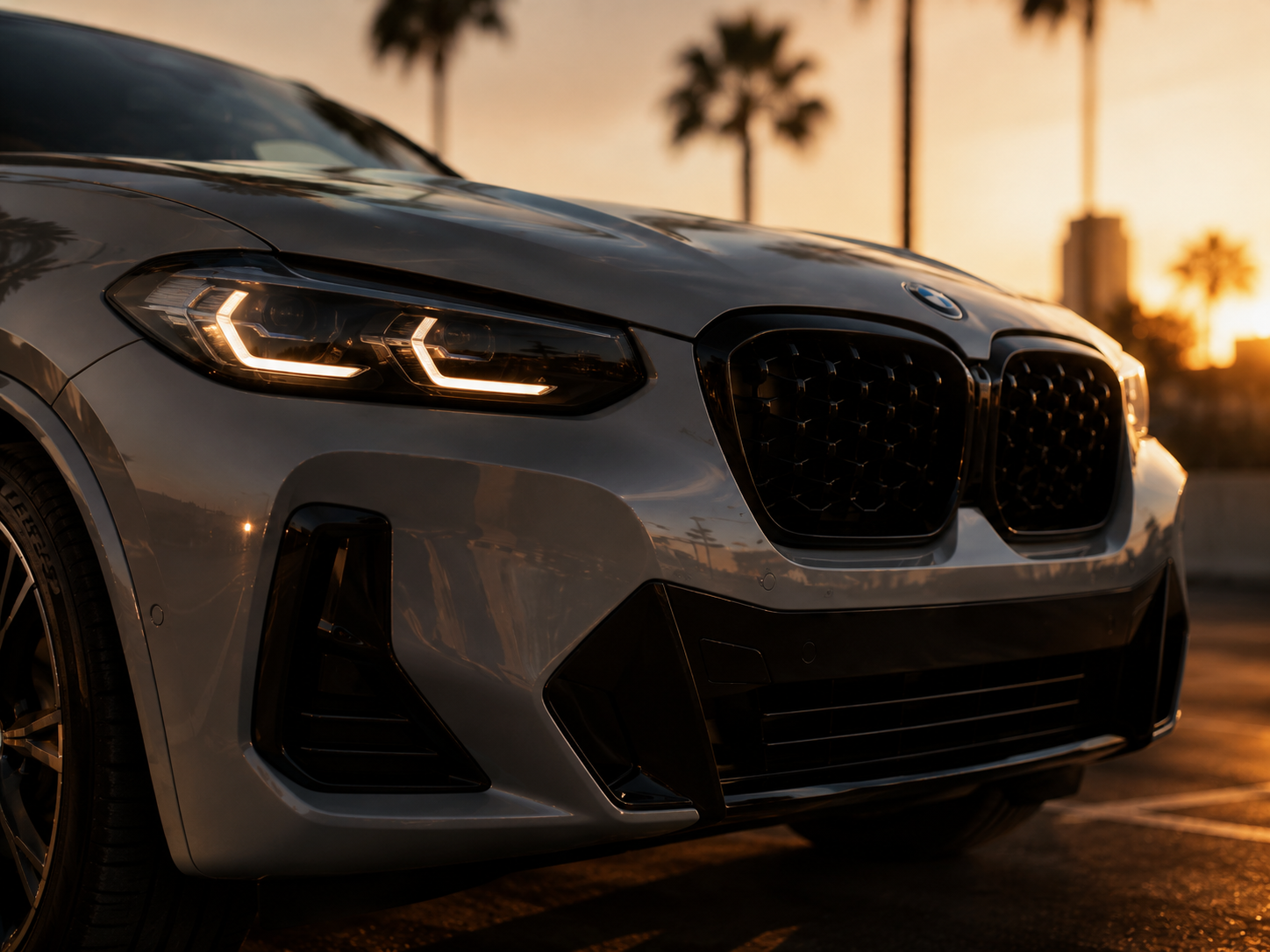 Close low-angle view of the BMW front and headlights